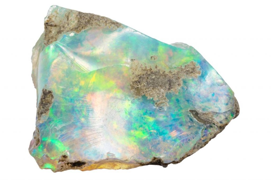 close up of sample of natural stone from geological collection - raw ethiopian opal mineral isolated on white background from Ethiopia